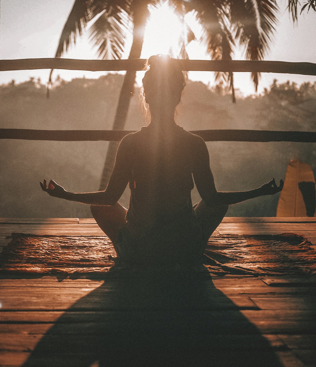 Person seated in a calm outdoor stretch
